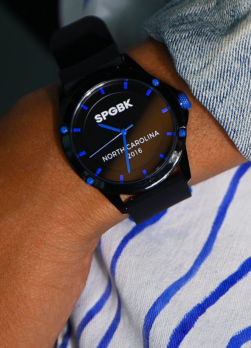 Black watch with blue accents on a wrist, featuring 'SPGBK' and 'North Carolina 2016' text.